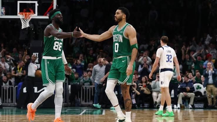 Jayson Tatum dribbling the basketball during a Celtics game at TD Garden.