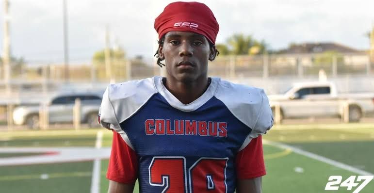 Five-star football recruit A'mir Sears poses in his high school uniform during a scouting session.