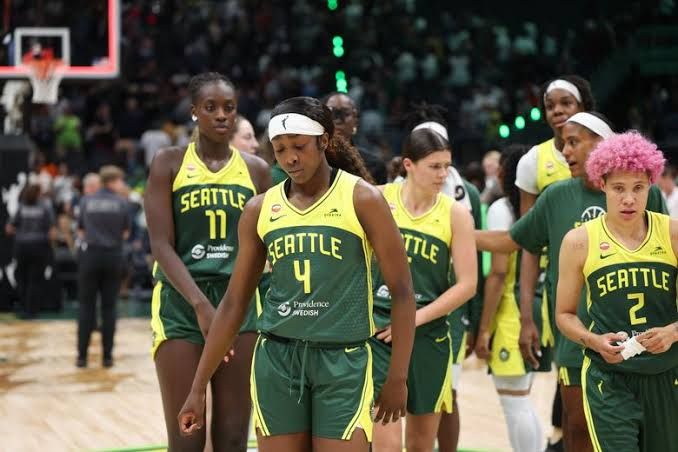 Flau’jae Johnson and the Seattle Storm players walking off the court after a close loss to the Minnesota Lynx.