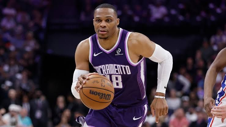 Russell Westbrook dribbles the basketball while playing for the Sacramento Kings during a home game.