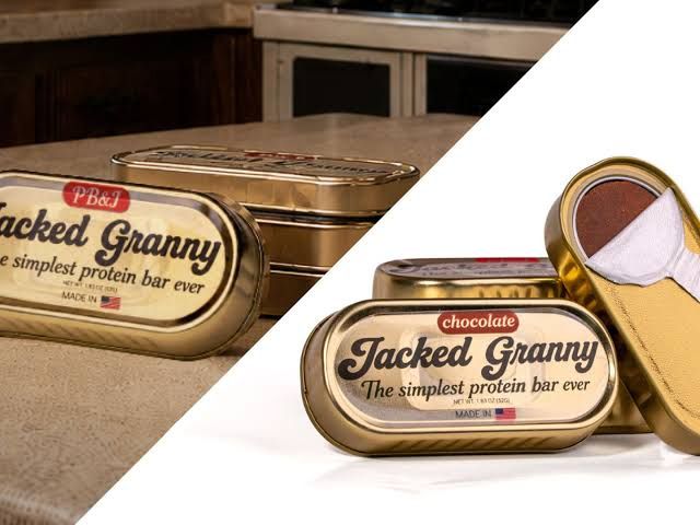 Protein bars in metal containers resembling sardine tins with a pull-tab lid.