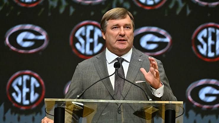 Kirby Smart stands at a microphone during an SEC press event addressing the future of college football.