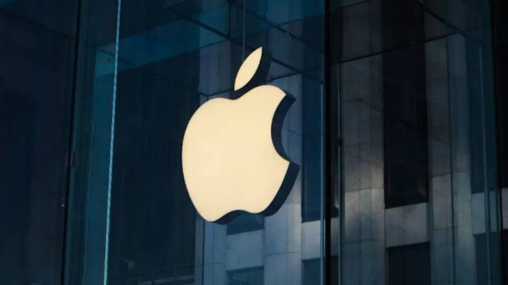 A stylized concept of a foldable phone being held in front of the Apple Park headquarters in Cupertino.