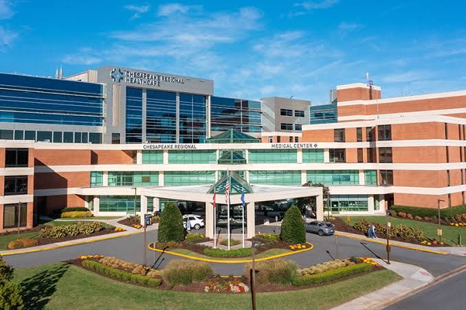 Chesapeake Regional Medical Center building sign shown during a news report on the DOJ settlement.