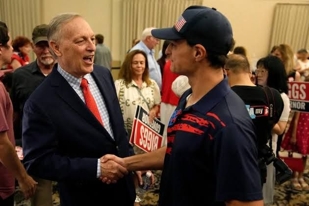 Rep. Andy Biggs greeting a supporter at a campaign event in Gilbert, Arizona, on July 17, 2026.