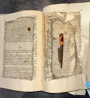 A fixed-blade knife hidden inside a book with the center pages carved out, found by TSA agents at Tampa International Airport.