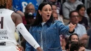 Toronto Tempo head coach Sandy Brondello standing on the sidelines during a WNBA basketball game.