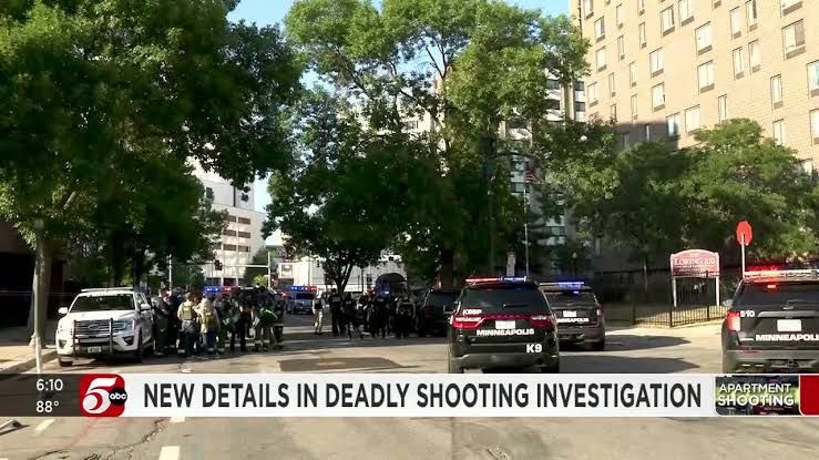 Minneapolis police squad cars and emergency responders outside Shoreline Plaza following the fatal shooting.