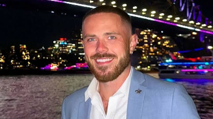 Bravo reality TV star Nathan Gallagher on the deck of a yacht during a filming sequence for Below Deck Mediterranean.