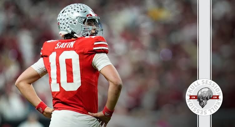 Julian Sayin prepares to throw a pass during a college football game while wearing his Ohio State uniform.