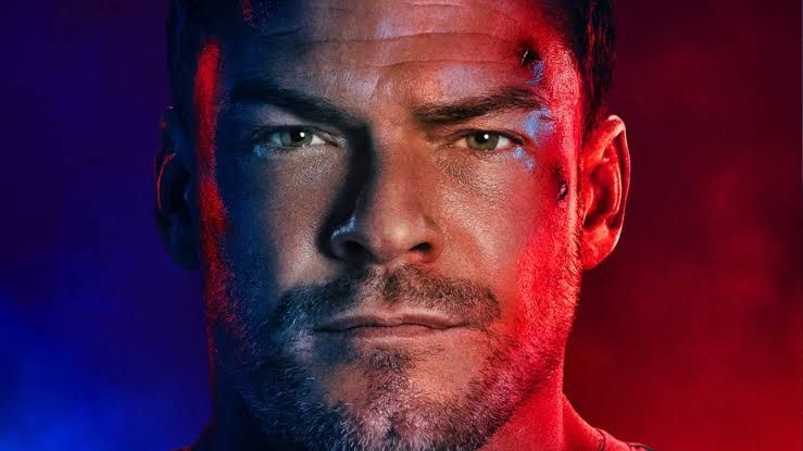 Alan Ritchson stands ready for action in a promotional poster for the fourth season of the Prime Video series Reacher.