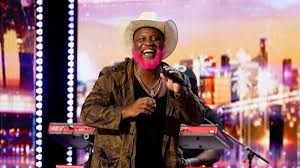 Pynk Beard performing on the America's Got Talent stage before the judges.
