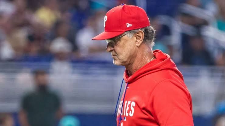 Interim manager Don Mattingly standing in the dugout during a Phillies game at the stadium.