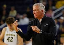 Toledo basketball head coach Tod Kowalczyk standing on the court inside Savage Arena.