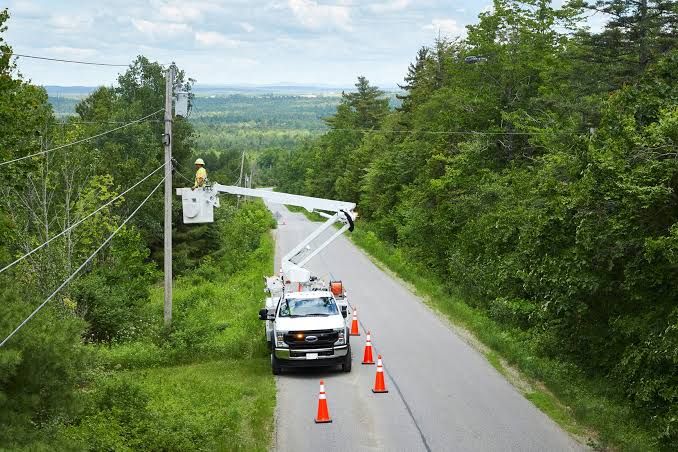 Fiber optic construction equipment installing new cables in a rural Ohio neighborhood near McConnelsville.