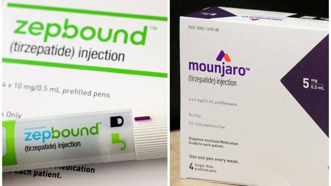 Close up of an Eli Lilly Mounjaro injection pen on a clinical desk with medical charts in the blurred background.