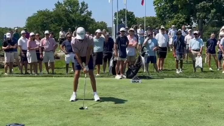 Golfers competing on the green at the U.S. Junior Amateur Championship at Saucon Valley Country Club.