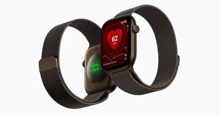 Apple CEO John Ternus presenting the new Apple Watch Series 12 and health app interface on a large stage display.