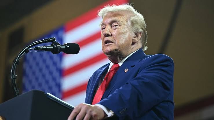 President Donald Trump delivering a speech at Wheeler High School regarding new trade tariff policies.