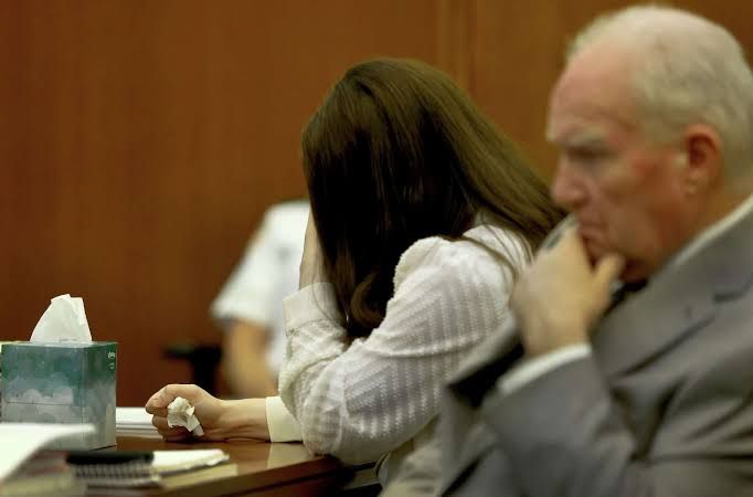 Lindsay Clancy sits in court during testimony while her attorney Kevin Reddington sits to her right.