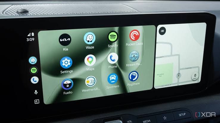 Close-up of a car dashboard showing a list of niche Android Auto applications like Fuelio and SpotHero.