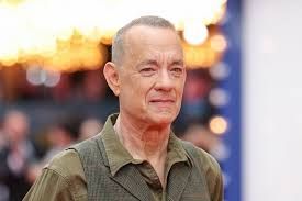 Tom Hanks attending a film event, representing a potential casting choice for the adaptation of Theo of Golden.
