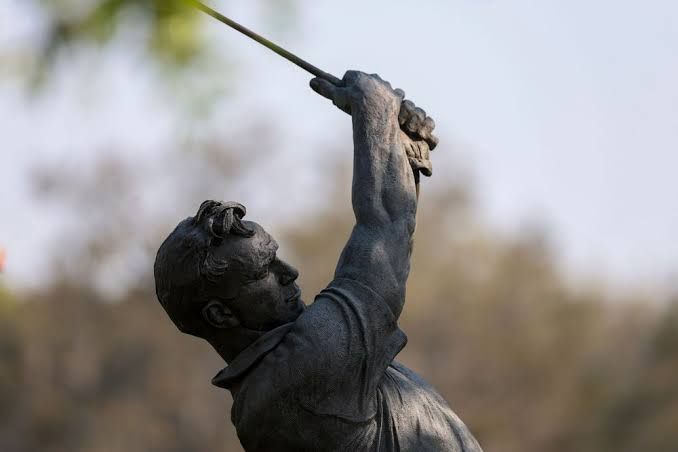 PGA TOUR professional golfer on a green during a tournament at a championship venue.