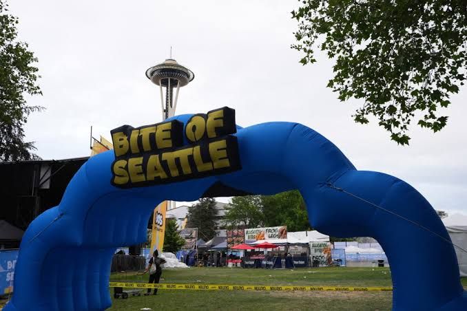 Police tape surrounds the Bite of Seattle food festival grounds near the Space Needle following a deadly shooting.