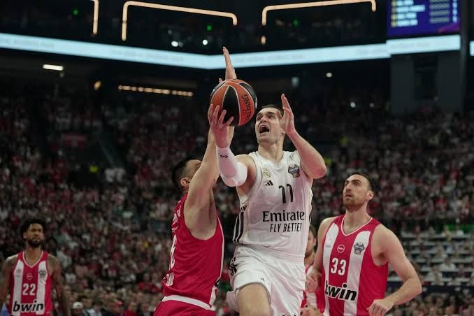 Mario Hezonja playing professional basketball on the court during a high-stakes European league match.