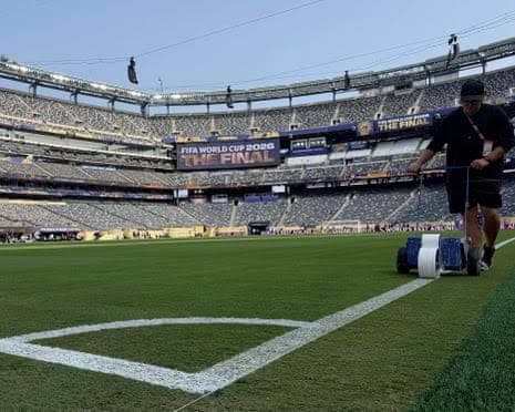 US Secret Service agents conduct security checks on staff and fans entering MetLife Stadium for the World Cup final.