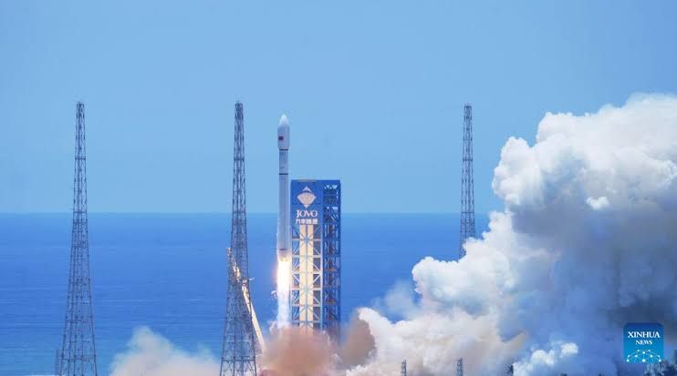 Long March-12 rocket launching from a commercial space site in Hainan Province with internet satellites on board.