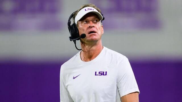 Lane Kiffin looking on from the sidelines during an SEC football game.