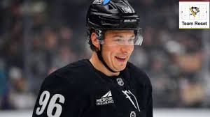 Andrei Kuzmenko scoring a goal for the Los Angeles Kings during a power play opportunity in an NHL game.