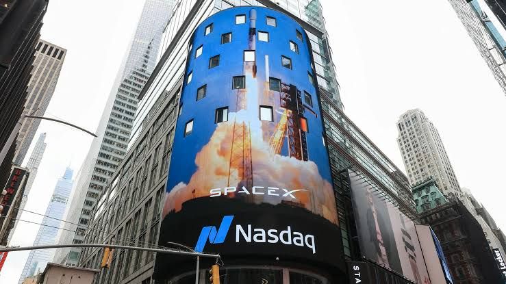 SpaceX logo displayed alongside financial report charts indicating market performance trends.