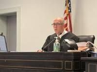 Judge Michael Howard sitting in the Columbia County courtroom during a legal proceeding in February 2026.