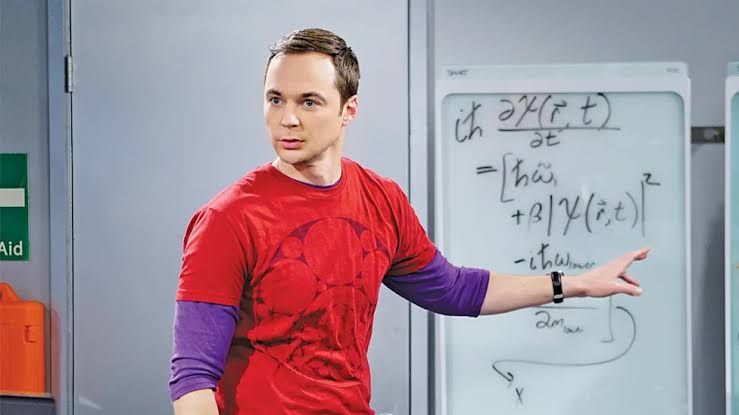 Jim Parsons smiling at a red carpet event for an awards ceremony.