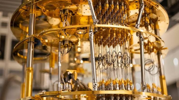 A close-up view of a complex cryogenic quantum computing processor chip inside a dilution refrigerator.