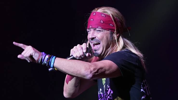 Bret Michaels performing on stage during a concert before his 2026 tour cancellation.