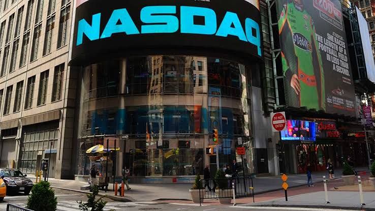 Traders monitor shifting stock price trends on a digital display board during the Wednesday session.