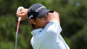 Charlie Woods walking on the golf course during a competitive round at the U.S. Junior Amateur tournament.