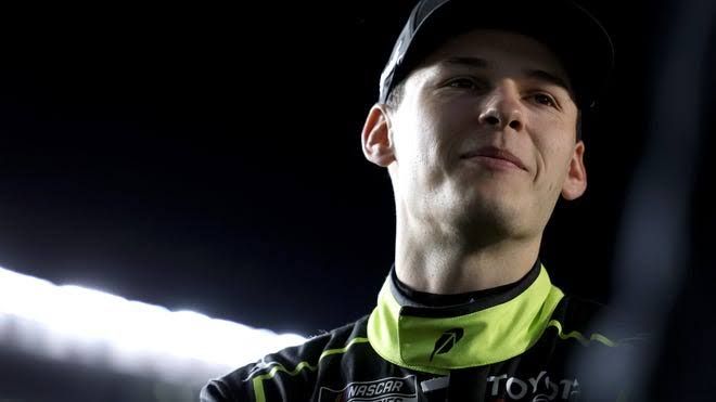 Corey Heim celebrating after winning the NASCAR race at Indianapolis Motor Speedway.