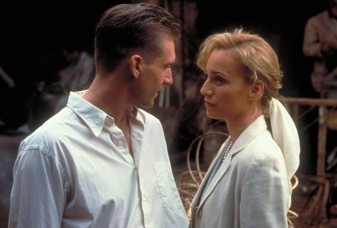 Ralph Fiennes and Kristin Scott Thomas standing together in a scene from the 1996 film The English Patient.