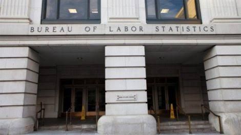 Bureau of Labor Statistics seal and office building facade representing employment data trends.