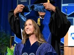 Trisha Campanaro standing next to her adviser, professor Issam Abu-Mahfouz, following her doctoral graduation.