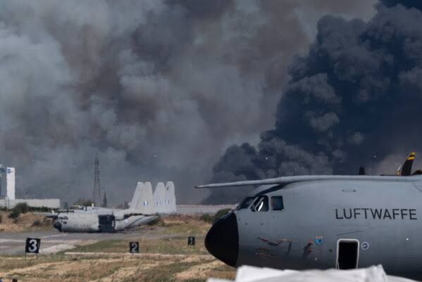 Smoke rises from the site of a Hellenic Air Force F-4 Phantom crash at Tanagra Air Base during an air show.
