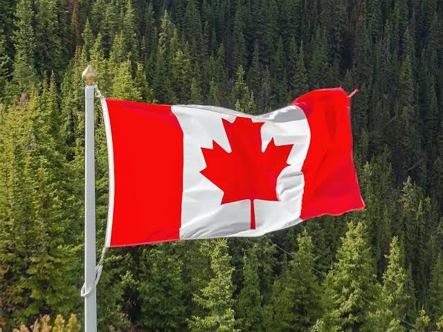 The Canadian flag flying in front of a government building in Ottawa during the trade dispute.