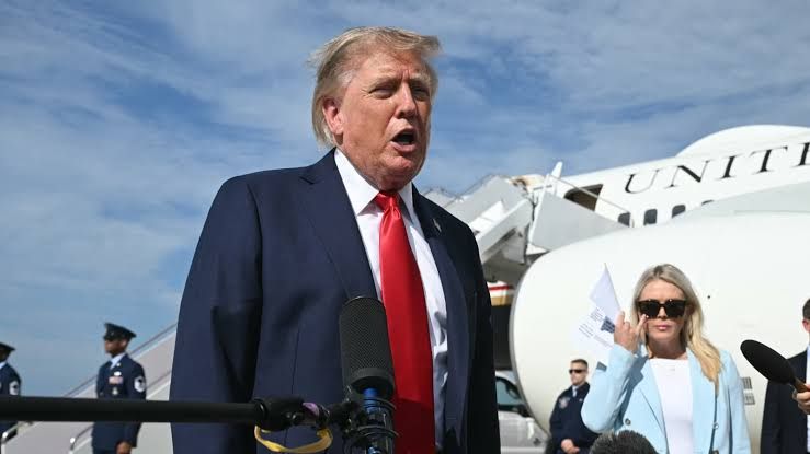 President Donald Trump walking toward a plane at Joint Base Andrews before a campaign event in South Carolina.