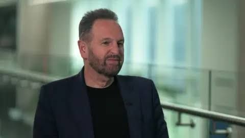 Arm Holdings CEO Rene Haas wearing a dark blue blazer during an interview about chip manufacturing and AI.