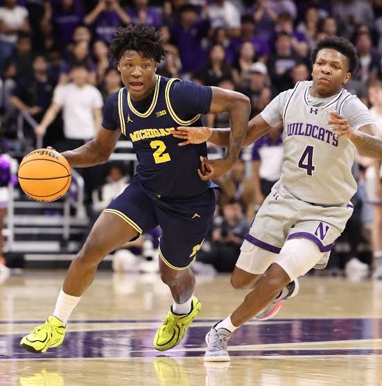 L.J. Cason in a Michigan basketball uniform on the court during a game.
