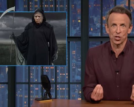 Seth Meyers speaking at a desk during his late-night show about the president's World Cup appearance.